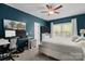 Comfortable bedroom with dark blue walls, white trim, large window, and a ceiling fan at 367 Neely Store Rd, Rock Hill, SC 29730