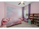 Charming pink bedroom with colorful decor, built-in bookshelf and a cozy reading nook at 367 Neely Store Rd, Rock Hill, SC 29730