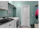 Functional laundry room with washer, dryer, shelving, and storage space at 367 Neely Store Rd, Rock Hill, SC 29730