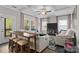 Open-concept living area with bar seating, comfortable sofas, and views to the outdoor deck at 367 Neely Store Rd, Rock Hill, SC 29730