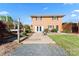 Brick home exterior with a walkout patio and landscaped backyard at 36984 B&C Carter Rd, New London, NC 28127