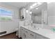 Bright bathroom with white tile, modern fixtures, and a large mirror at 36984 B&C Carter Rd, New London, NC 28127