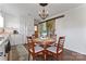 Cozy dining area features a glass table, seating for four, and a rustic sliding barn door at 36984 B&C Carter Rd, New London, NC 28127