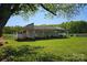Open-air barn structure in a grassy field perfect for equipment or livestock at 36984 B&C Carter Rd, New London, NC 28127