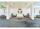 Inviting front porch with rocking chairs and white brick columns at 36984 B&C Carter Rd, New London, NC 28127