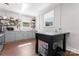 Bright kitchen with open shelving and gray cabinets at 36984 B&C Carter Rd, New London, NC 28127