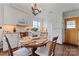 Bright kitchen with white cabinetry, modern appliances, and a cozy breakfast nook at 36984 B&C Carter Rd, New London, NC 28127