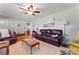 Spacious living room with a large leather sofa, area rug, and natural light at 36984 B&C Carter Rd, New London, NC 28127