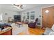 Cozy living room featuring hardwood floors, a plush rug, and comfortable seating at 36984 B&C Carter Rd, New London, NC 28127