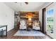 Inviting sitting area with rustic wood wall, comfortable chairs, and a decorative rug at 36984 B&C Carter Rd, New London, NC 28127
