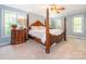 Spacious bedroom featuring a gorgeous four poster bed and natural light at 3815 Glen Haven Sw Dr, Concord, NC 28027