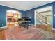 Inviting formal living room featuring hardwood floors, a decorative rug, and access to the staircase at 3815 Glen Haven Sw Dr, Concord, NC 28027