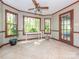 Bright sun room featuring a ceiling fan and lots of natural light at 3815 Glen Haven Sw Dr, Concord, NC 28027