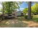 A charming home with mature trees, a convenient carport, and a well-maintained lawn with a nice driveway at 441 Kimbrook Ct, Rock Hill, SC 29730