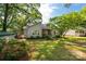 Charming single-story home with well-manicured lawn, a wooden deck, and mature trees providing ample shade at 441 Kimbrook Ct, Rock Hill, SC 29730