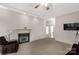 Comfortable living room features a fireplace, carpet flooring, and a mounted TV for relaxed living and entertaining at 441 Kimbrook Ct, Rock Hill, SC 29730