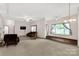 Bright and airy living room with plush carpet, ceiling fans, and abundant natural light from large windows at 441 Kimbrook Ct, Rock Hill, SC 29730