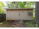 Backyard shed with double doors and a small porch at 441 Kimbrook Ct, Rock Hill, SC 29730