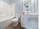 Bright bathroom features a tub, toilet, and white vanity with a mirror at 526 Pennyfields Ln, Clover, SC 29710