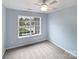 Bedroom with a ceiling fan and a large window offering a view of the neighborhood at 526 Pennyfields Ln, Clover, SC 29710