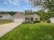 Charming single-story home with a well-manicured front yard and attached two-car garage at 526 Pennyfields Ln, Clover, SC 29710