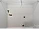 Laundry room with utility connections, white walls, and a wire shelf at 526 Pennyfields Ln, Clover, SC 29710