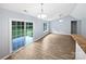 Living area featuring an open floor plan with wood floors, and sliding glass doors to the patio at 526 Pennyfields Ln, Clover, SC 29710
