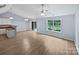 Bright living room features wood floors, fan, and sliding glass doors to the outdoor at 526 Pennyfields Ln, Clover, SC 29710