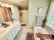 Bathroom featuring double sinks, a shower with glass doors, and a soaking tub at 5505 Weavers Row, Gastonia, NC 28056