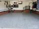 Spacious two-car garage with painted floor, ample storage, and a TV for entertainment at 5505 Weavers Row, Gastonia, NC 28056