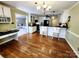 Bright kitchen features stainless steel appliances, a large island, and hardwood floors at 5505 Weavers Row, Gastonia, NC 28056