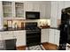 Close-up view of the kitchen featuring stainless steel appliances and modern cabinetry at 5505 Weavers Row, Gastonia, NC 28056