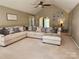 Spacious living room with high ceilings, neutral tones, and plush seating, creating a cozy and inviting atmosphere at 5505 Weavers Row, Gastonia, NC 28056