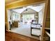 Light-filled sunroom with comfortable seating and a view of the backyard at 5505 Weavers Row, Gastonia, NC 28056