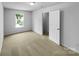 Bright bedroom featuring plush carpet, a large window offering natural light, and a closet at 614 Saratoga Dr, Clover, SC 29710