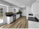 Modern kitchen equipped with stainless steel appliances, sleek countertops, ample cabinetry, and backyard access at 614 Saratoga Dr, Clover, SC 29710
