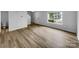 Bright and airy living room featuring light-colored flooring, ample natural light, and a view of the front yard at 614 Saratoga Dr, Clover, SC 29710