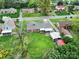 Aerial view of a beautiful backyard featuring ample green space, a shed, and mature trees at 7410 Middlebury Pl, Charlotte, NC 28212