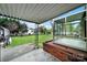 View of backyard with a covered porch and a sunroom at 7410 Middlebury Pl, Charlotte, NC 28212