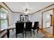 Elegant dining room features a ceiling fan and window with a view to the outside at 7410 Middlebury Pl, Charlotte, NC 28212