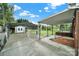 Driveway view with a carport, shed, covered porch and green lawn at 7410 Middlebury Pl, Charlotte, NC 28212