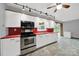 Open concept kitchen featuring stainless steel appliances, overhead lighting and bright counter tops at 7410 Middlebury Pl, Charlotte, NC 28212