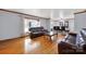 Spacious living room with hardwood floors and large window, filled with natural light at 7410 Middlebury Pl, Charlotte, NC 28212