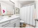 Clean bathroom featuring a white vanity, modern fixtures, and a shower with a curtain at 8143 Warford Little Rd, Denver, NC 28037