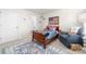 Cozy bedroom with patriotic decor, comfortable seating, and a warm, inviting ambiance at 8143 Warford Little Rd, Denver, NC 28037