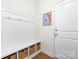 Well-organized entryway with built-in bench, storage cubbies, and coat hooks at 8143 Warford Little Rd, Denver, NC 28037