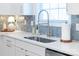 Kitchen sink and countertop with stainless steel faucet and window in the background at 8143 Warford Little Rd, Denver, NC 28037