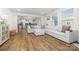 Spacious living room boasts hardwood floors, an open layout, and ample natural light at 8143 Warford Little Rd, Denver, NC 28037