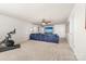 Open living room with a large tv, and comfortable seating at 8143 Warford Little Rd, Denver, NC 28037