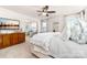 Spacious main bedroom featuring a ceiling fan, sitting area and a large dresser with mounted TV at 8143 Warford Little Rd, Denver, NC 28037